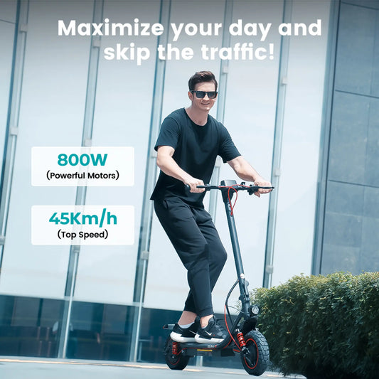 iScooter i10 electric scooter with dual suspension riding on city street